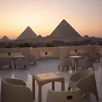 Hussien Lotus Pyramids View